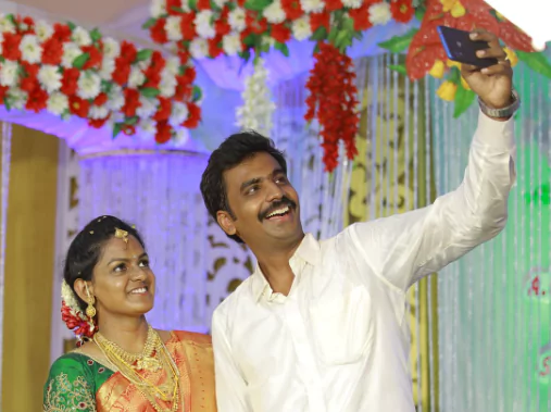 Anchor Avudaiappan with his wife Sangeetha.